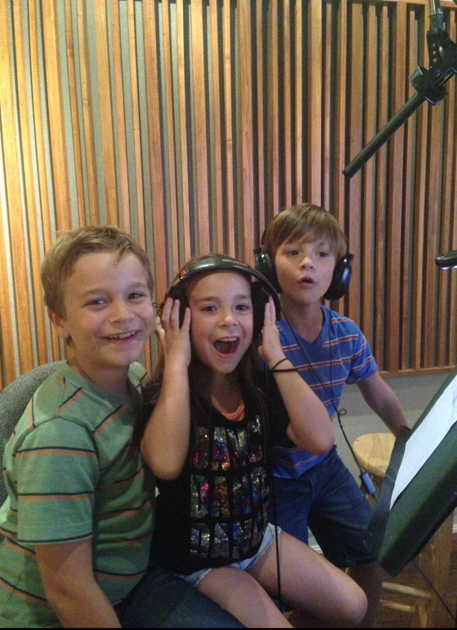 LionHeart talent in professional recording studio doing voice work with headphones